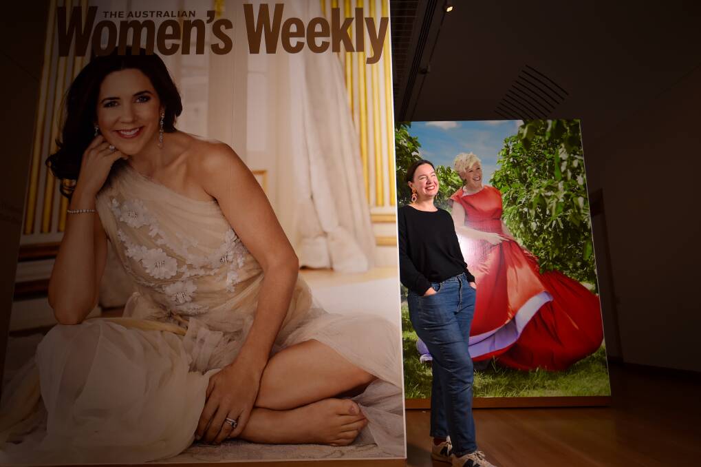 Curator Lauren Ellis getting ready for the Bendigo Art Gallery's Women's Weekly exhibition. Picture by Darren Howe