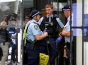 NSW Police on Castlereagh Street in Sydney after a shooting on February 28, 2024. Police arrested a man while paramedics took the shot man to hospital. Picture AAP Image/Bianca De Marchi
