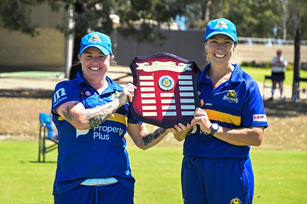 Bulldogs captain Tammy Norquay and coach Sarah Mannes lift the Lisa Chesters Shield. Picture by Enzo Tomasiello