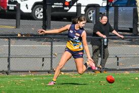 Bendigo Pioneer Ava Bibby attempts to pick up a loose footy. Picture by Enzo Tomasiello
