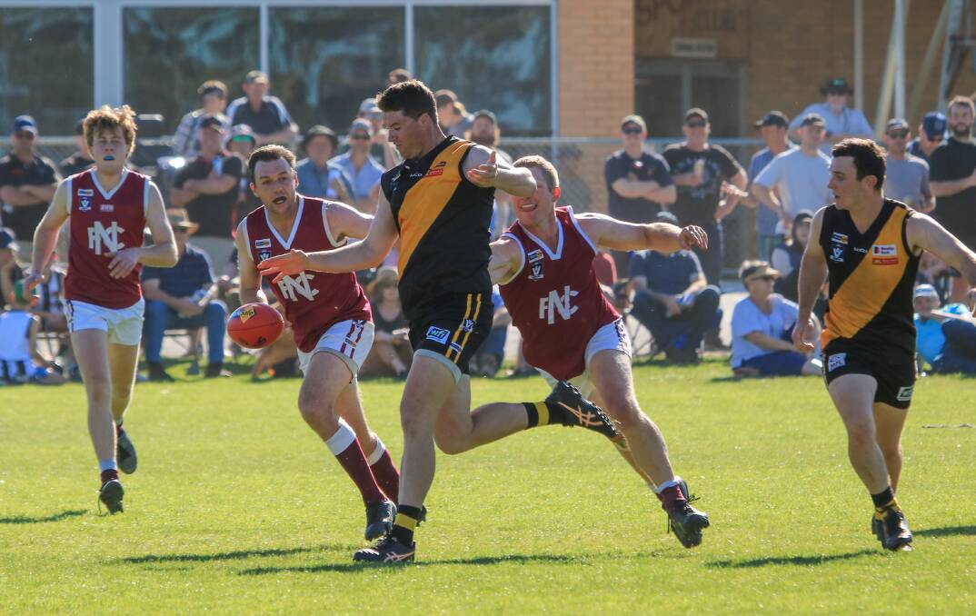 Billy McInnes boots the ball inside 50 during the 2023 grand final. Picture by Blake Lee 