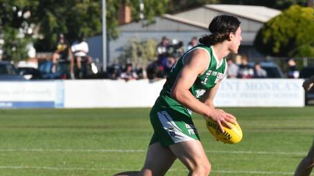 Kangaroo Flat's Campbell Smith assesses his options downfield. Picture by Adam Bourke