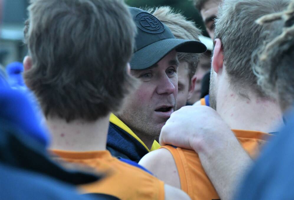 Golden Square coach Christian Carter adressing his troops. 