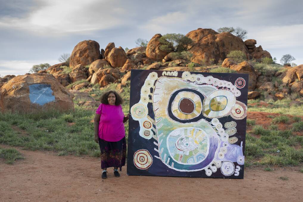 Artist Tuppy Ngintja Goodwin with her Arthur Guy Memorial Painting Prize winning work Antara. Picture supplied