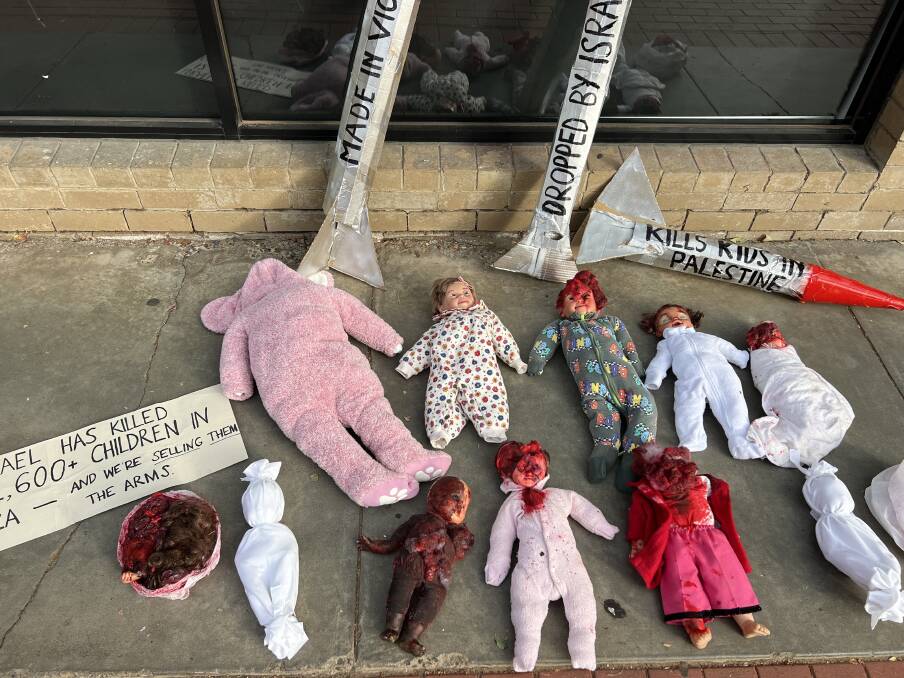 The dolls were "modeled on the horrific footage coming out of Gaza" the group said. Picture by Gabriel Rule