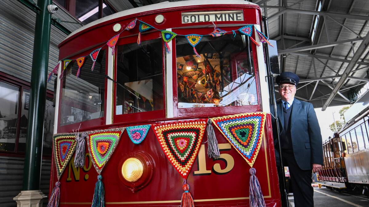Driver Chris Pollard with the 'yarn-bombed' no.15 tram. Picture by Darren Howe