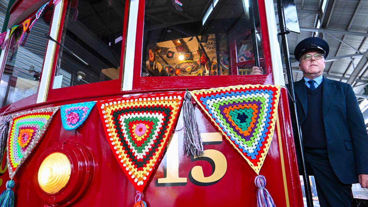 The yarn bombed tram with driver Chris Pollard. Picture by Darren Howe