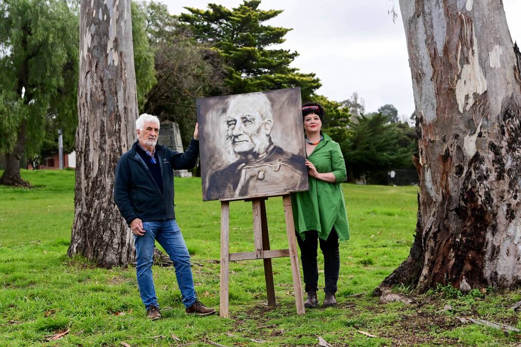 John Lewis and Alice Matthiesson from Gold Camp Castlemaine with a piece of work to be auctioned at the fundraiser. Picture by Brendan McCarthy 