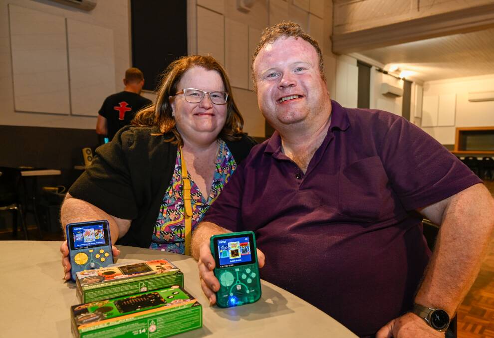 Amy and Michael Youla show off their consoles. Picture by Enzo Tomasiello