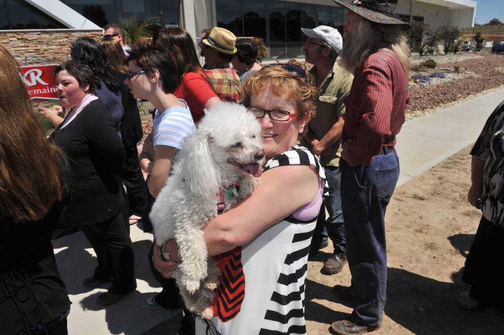 June Purdy with pooch Suzie ... who got a pat from the prince. Picture by Brendan McCarthy 