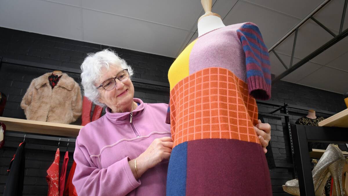 Volunteer Kath Beale gets a mannequin ready for open. Picture by Noni Hyett