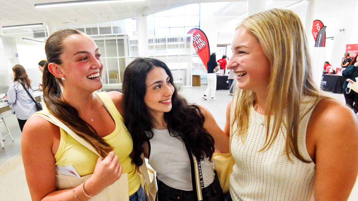Eve Bardsley, Christina Scalora and Millie Bennett on their first day as university students. Picture by Darren Howe. 