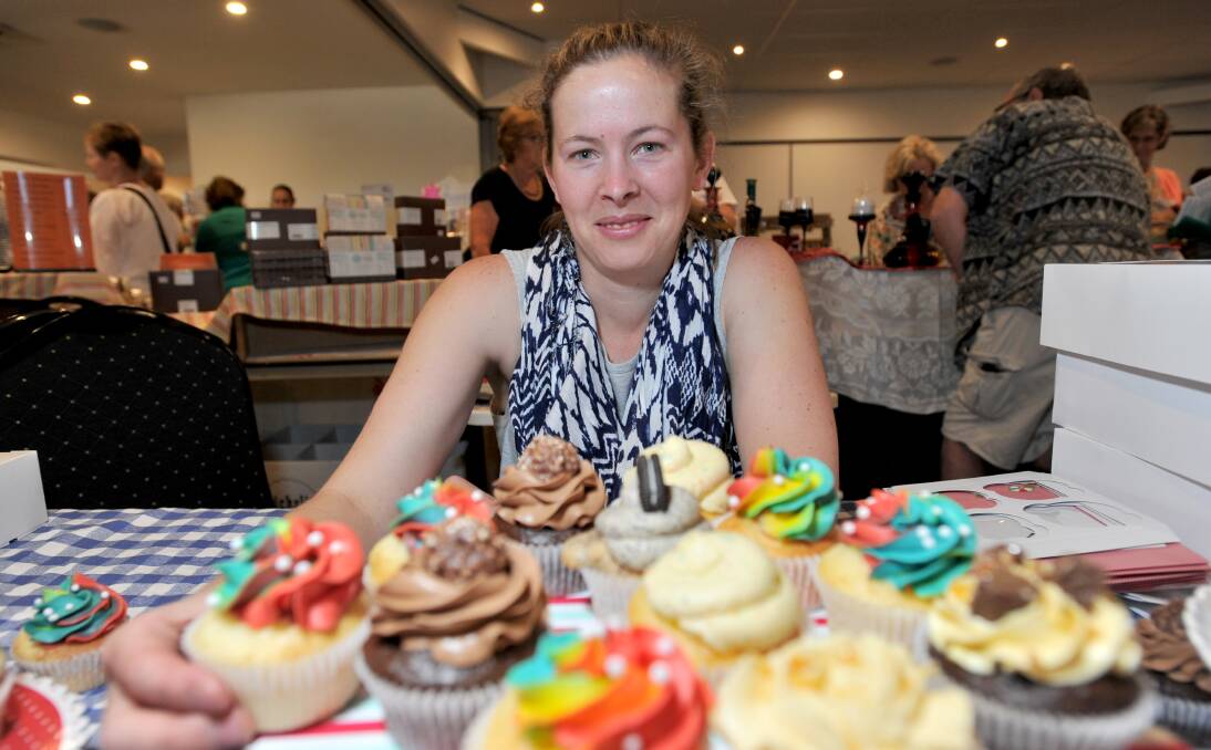 Fundraiser: Jarileey Scholtes shows off her Wisk Cupcakes at the Zonta Club of Bendigo's annual Christmas market on Saturday. Picture: NONI HYETT