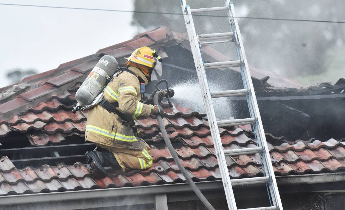 Emergency services on the scene of a house fire in California Gully. Pictures: DARREN HOWE
