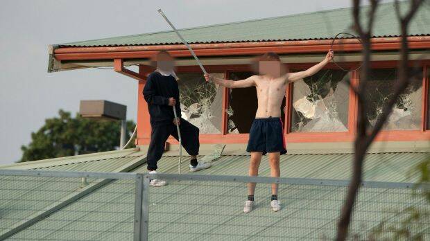 Youths protesting on the roof of the Parkville youth justice centre in March. Picture: JESSE MARLOW