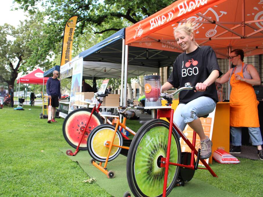 Els Viester uses pedal power to make her own smoothie at the Bike 'n' Blend stall for Open Streets Bendigo on Saturday. Picture: JASON WALLS