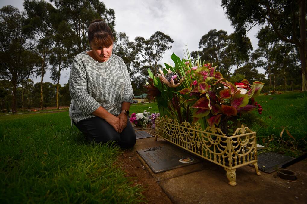 Joanne Jennings at her mother's grave in the Eaglehawk Cemetery. A pot that was on the grave since 1997 has been removed. Picture by Darren Howe