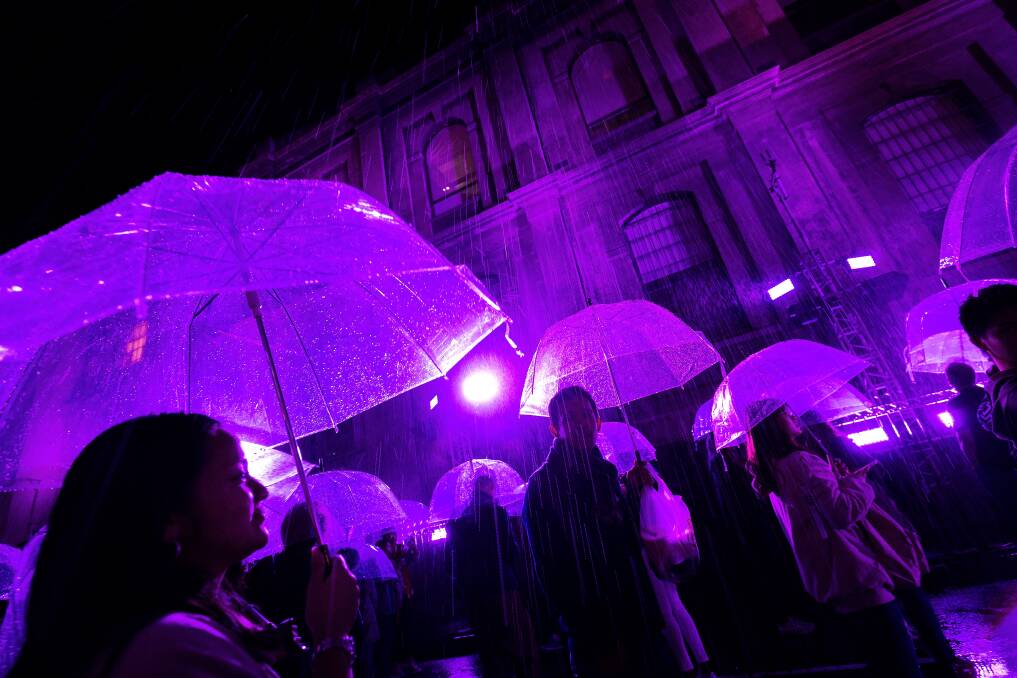 Melbournians enjoy the Purple Rain installation during White Night Melbourne last year. Picture: Chris Hopkins