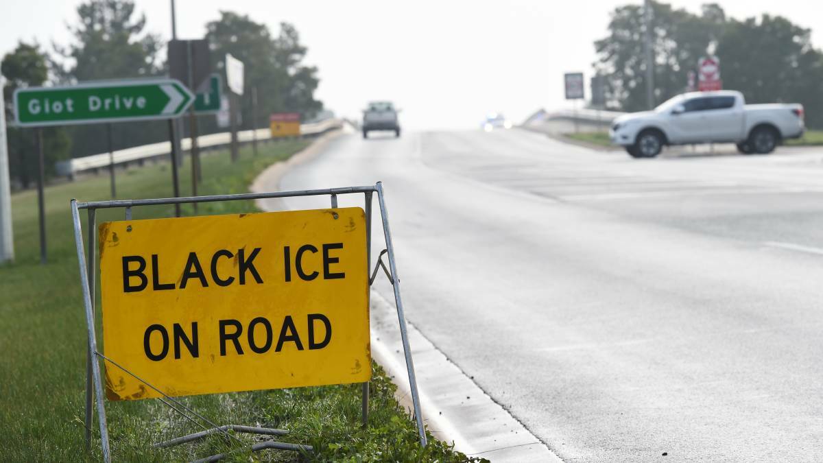 Truck rollover blocks road after reports of black ice