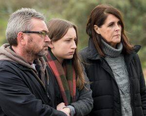 Karen Ristevski's family (L-R) her husband Borce, daughter Sarah and aunt Patricia at a public appeal last month. Photo: Penny Stephens
