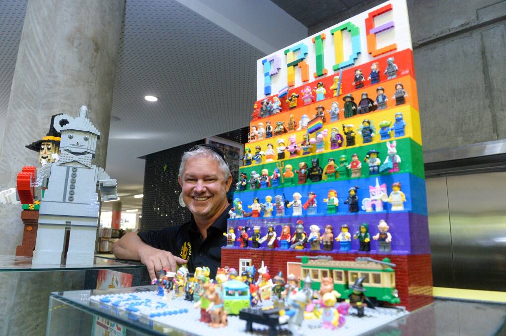 Lego ambassador Michael Peebles with a Bendigo Pride Festival display.