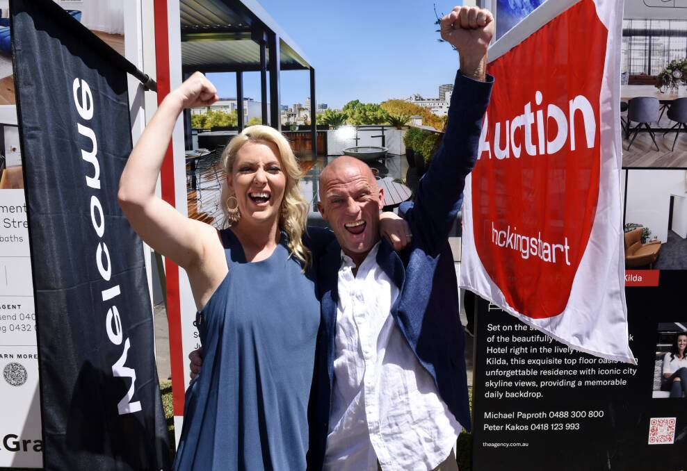 Jess Eva and Norm Hogan celebrate their result on auction day.