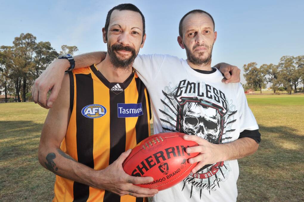 Nathan Dredge, left, used football to address his agoraphobia. Now he's a regular feature in the footy team. Picture: NONI HYETT