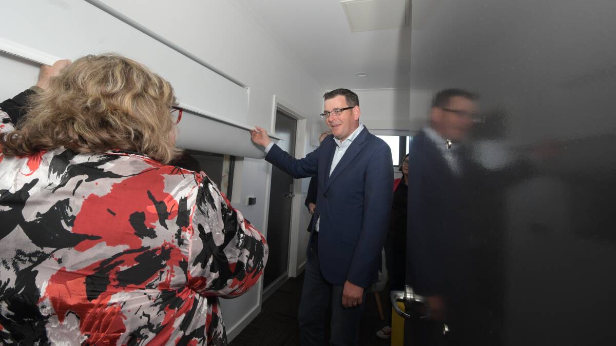 Daniel Andrews tours one of the six units. Picture: NONI HYETT