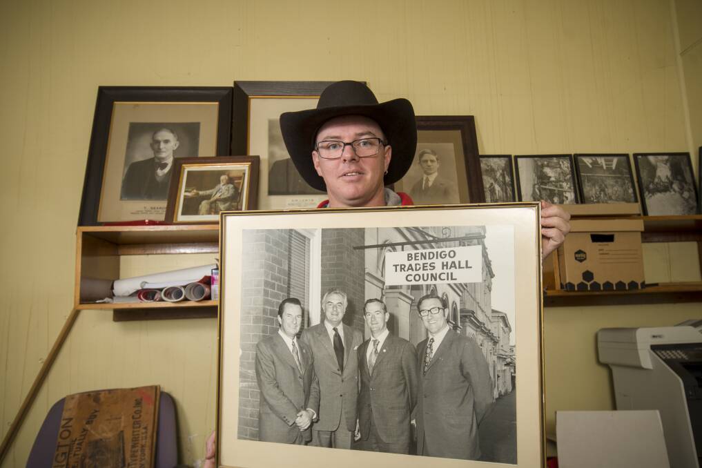 Luke Martin with an image of Gough Whitlam during his visit to Bendigo in the early 1970s. Picture: DARREN HOWE