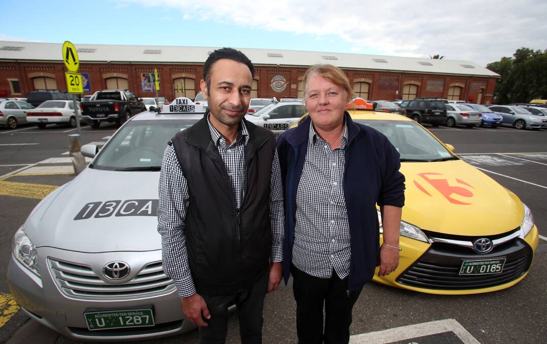 Bendigo 13CABS drivers Sukh Sangha and Karen Wright will wait and see how further taxi industry changes will impact Bendigo passengers. Picture: GLENN DANIELS