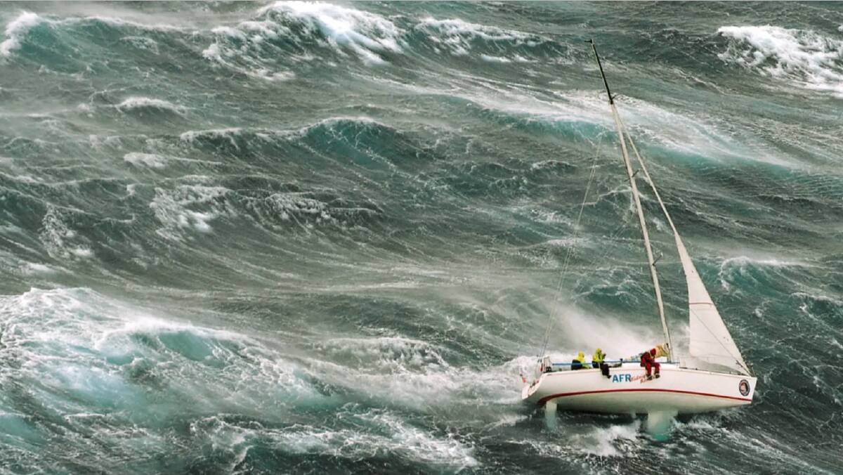 A yacht competing in the 1998 Sydney to Hobart attempts to ride out conditions in the Bass Strait as a storm hits. Picture: Richard Bennett Photography