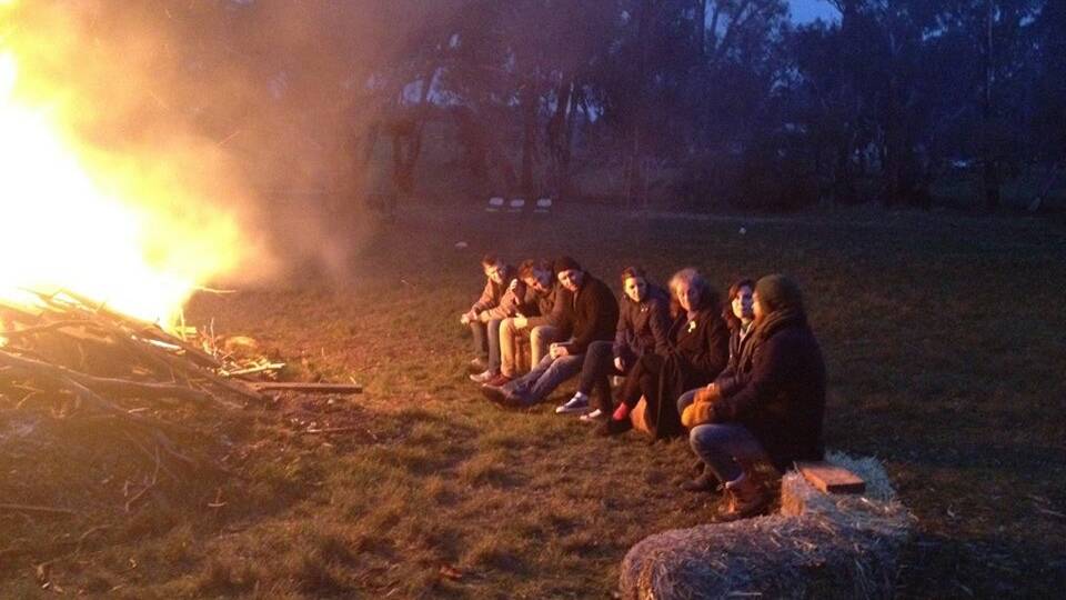 Friends celebrate Luke's birthday with a bonfire. Camping and spending time outdoors are his favourite activities.
