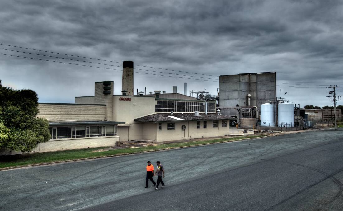 Former Heinz employees walk past the Girgarre factory in 2012 following its closure. Picture: Craig Sillitoe