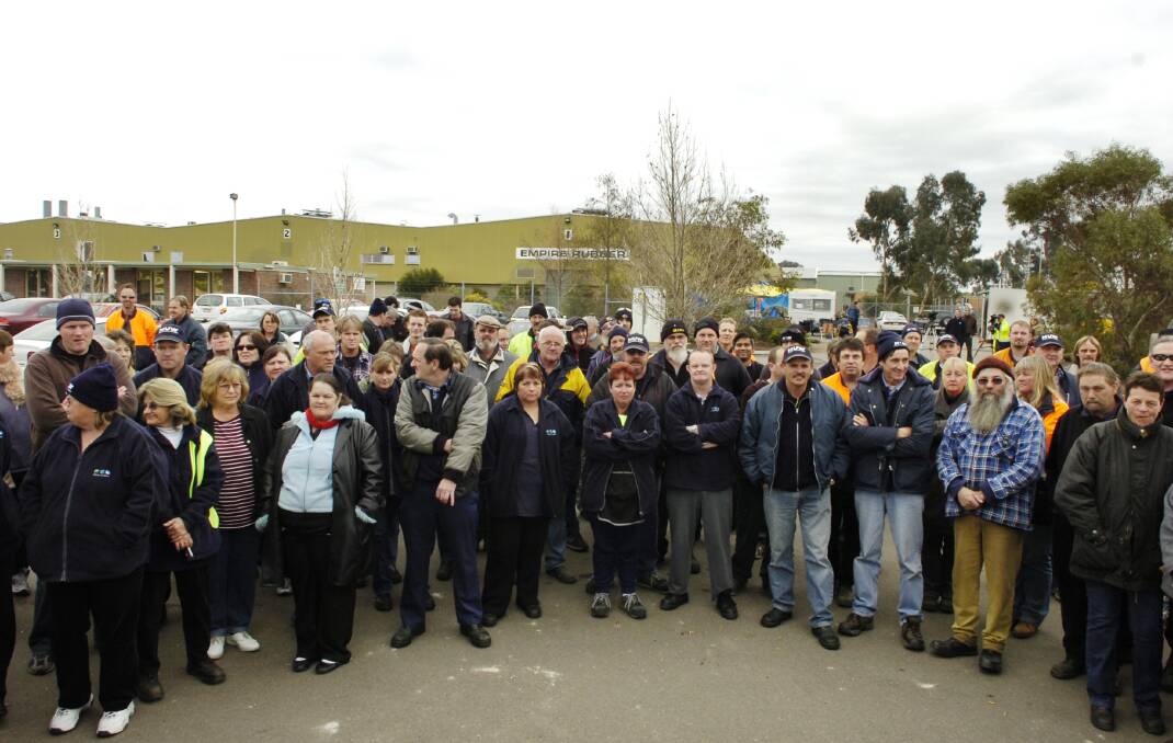 Empire Rubber workers picket the company in 2006.