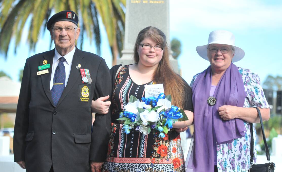 John Handley, Emily Ross and Dot Handley with their wreath laid in Kangaroo Flat in memory of Dot's father George Henry Churchill Jones. Picture: ADAM HOLMES