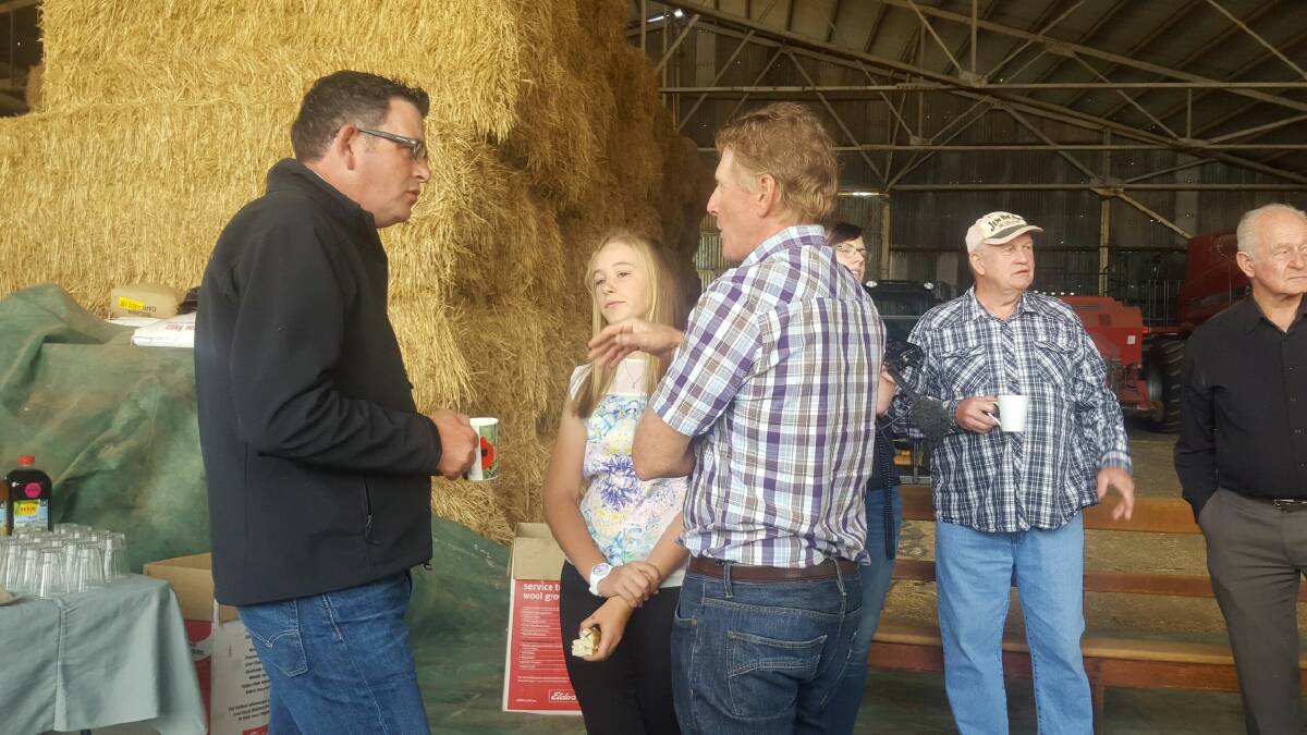 Premier Daniel Andrews talks with farmers at today's announcement near Wedderburn. Picture: ADAM HOLMES