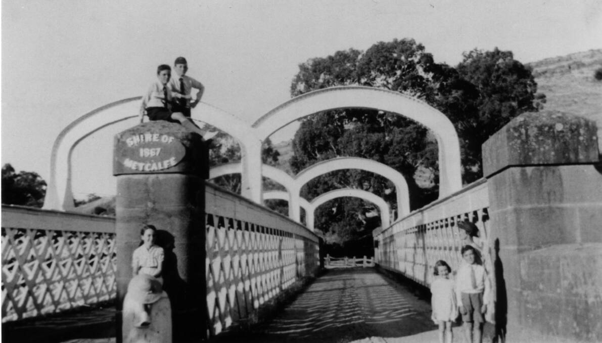 Children pose at the Redesdale Bridge in 1942.