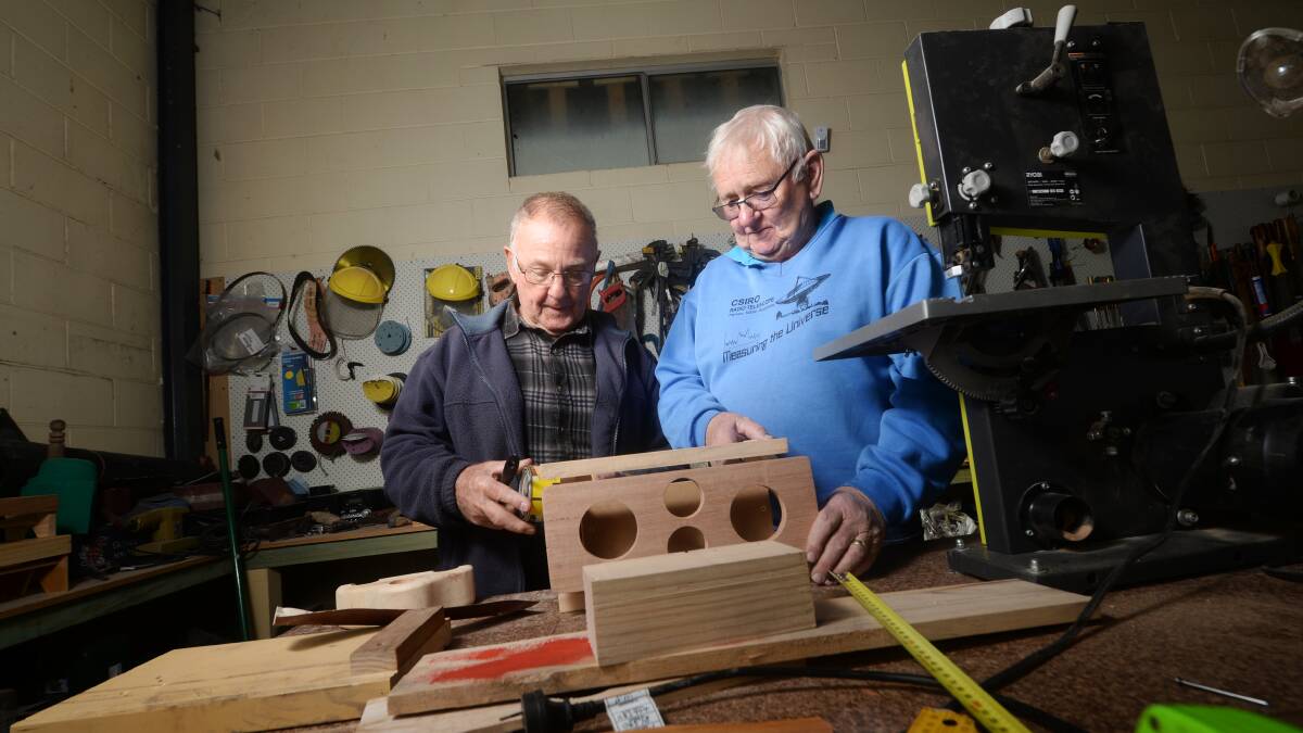 Harold Malone and Victor Cooper work in the Marong Men's Shed, a project made possible by the Lions Club. Picture: DARREN HOWE