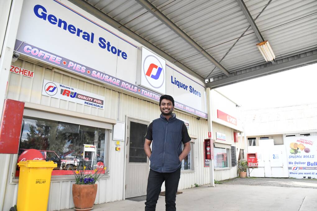 Just a few weeks earlier, Anurag Gangasani was living in Strathfield in inner-Sydney. Now he manages the Redesdale General Store where he and his partner have been embraced by the community. Picture: ADAM HOLMES