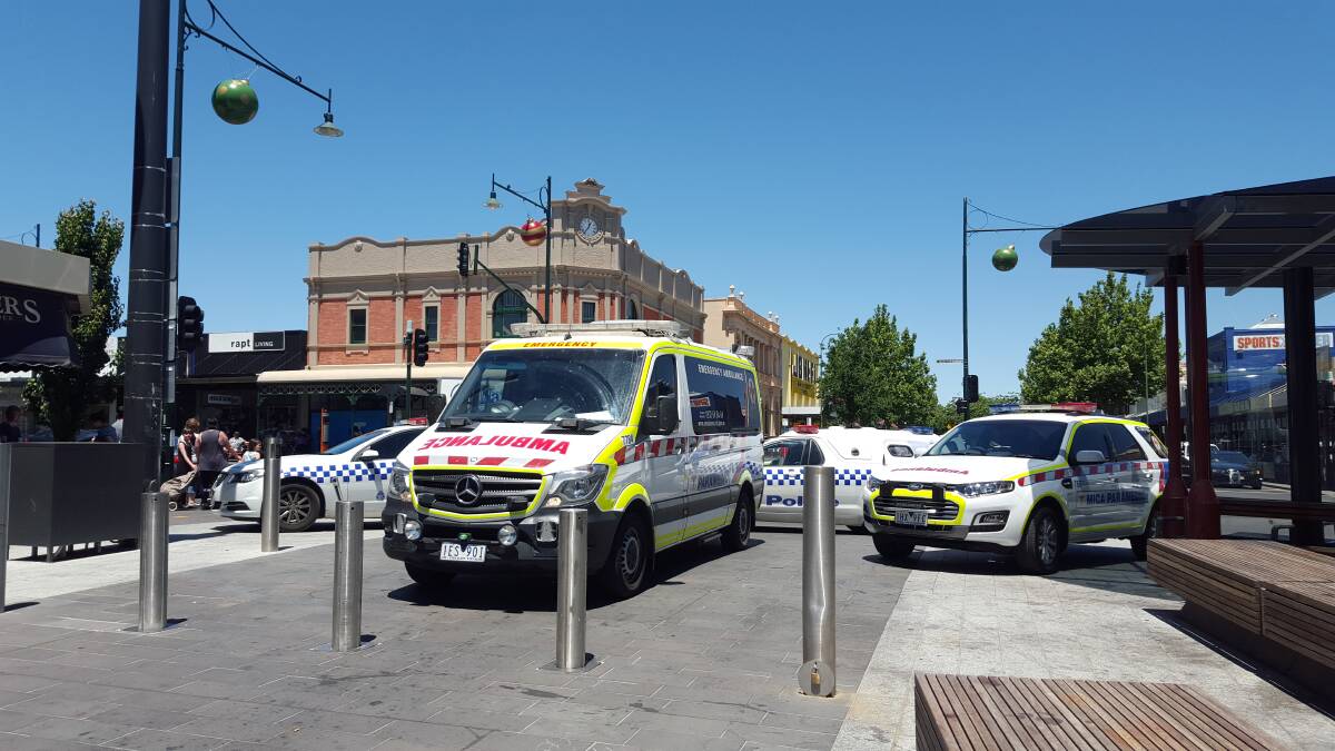 Police and ambulance officers attend a violent incident in Hargreaves Mall last month, in which a man was pepper sprayed. Bendigo police say greater CCTV coverage can be a deterrent to crime. Picture: ADAM HOLMES