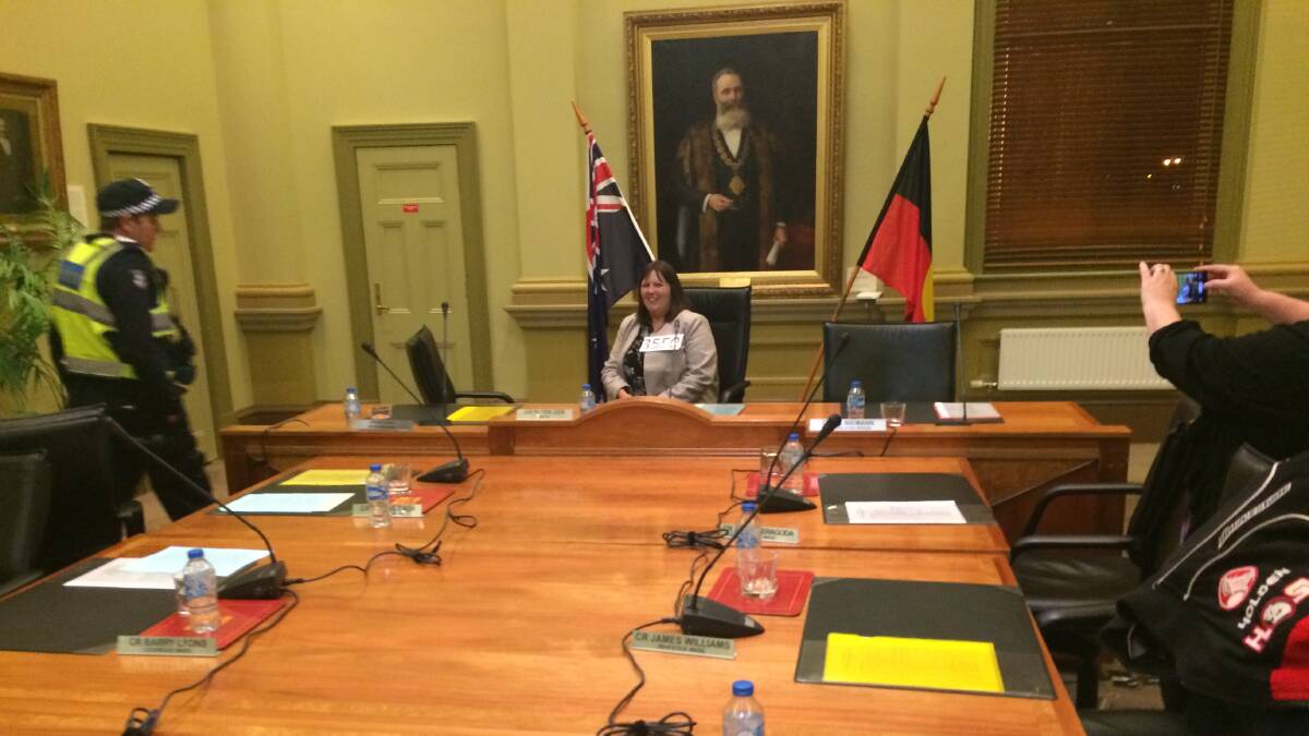 Julie Hoskin sits in the mayor's seat at a council meeting in September 2015 after anti-mosque protesters forced the meeting to be abandoned.