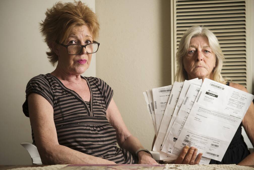 Robyn Nielson, right, with her debt recovery letters from Centrelink. Her matter is yet to be resolved, despite a subsequent letter saying Centrelink owed her money. Picture: DARREN HOWE