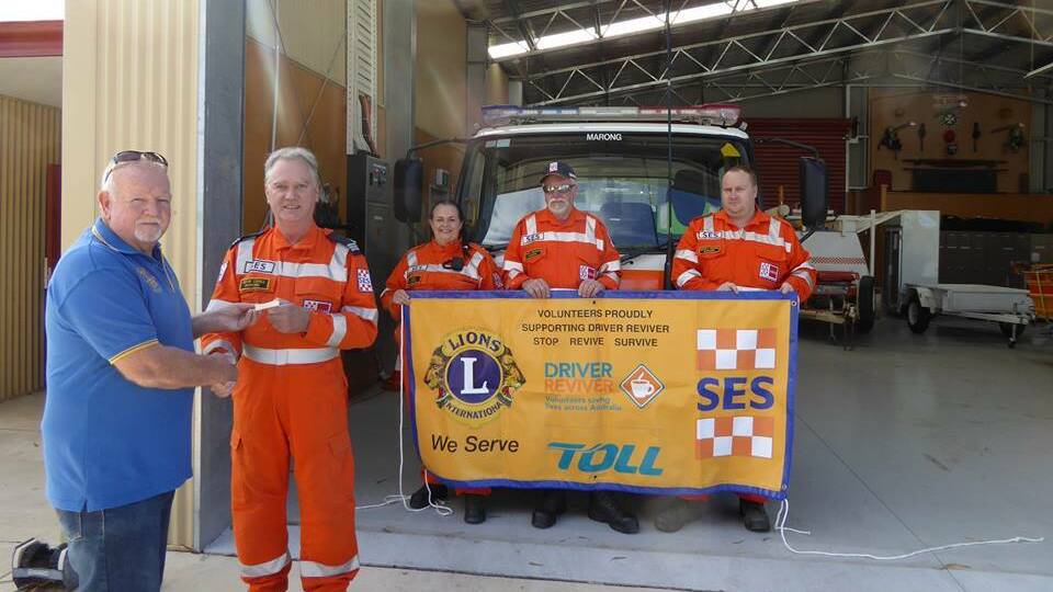 The Lions Club of Bendigo provides a cheque for $1600 to the Marong SES.