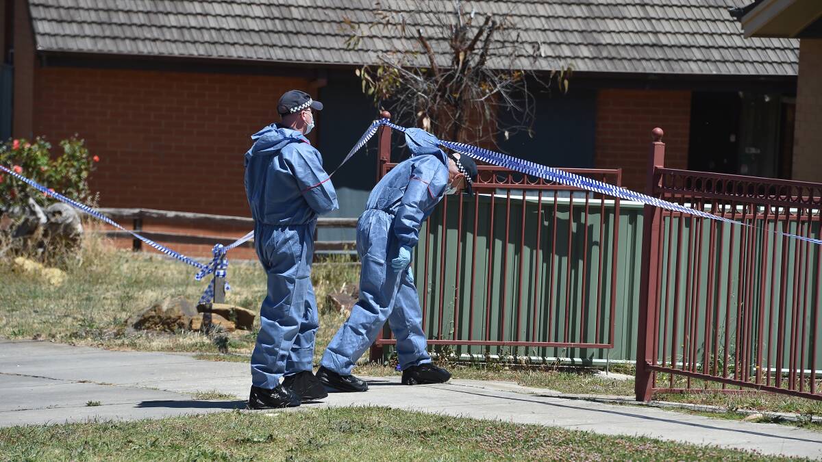 Police investigate the house on Derwent Drive in Long Gully. Picture: NONI HYETT