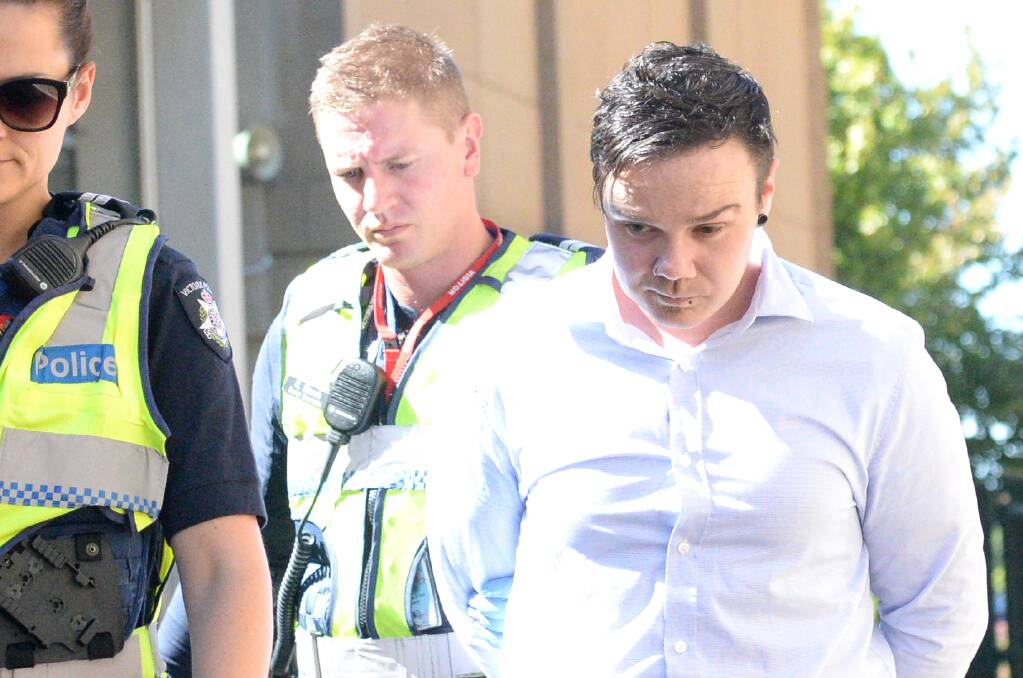 Adrian Robert Finley is led out of the Bendigo County Court in custody on Wednesday. Picture: DARREN HOWE
