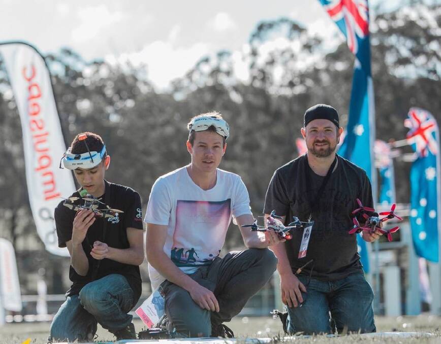 Michael Webb, centre, of Bridgewater, prepares for the national drone racing final on the Gold Coast. His second place finish won him a trip to compete in Hawaii. Picture: Michael Greves Photography
