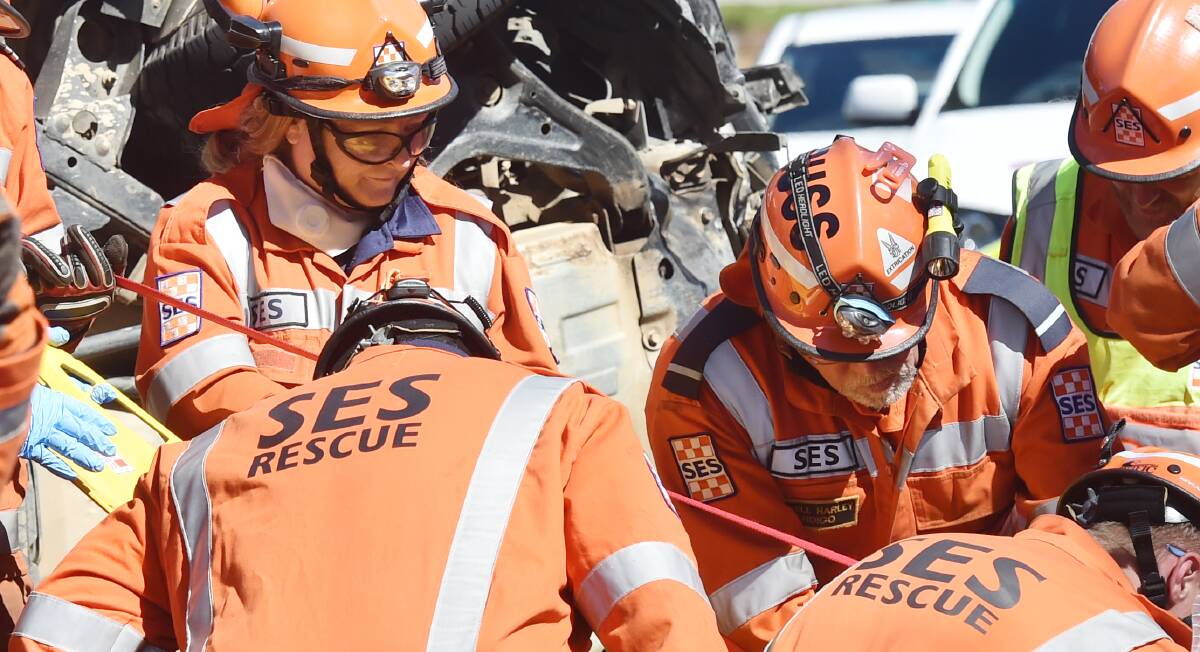 SES members work to free a driver involved in a crash on Marong Road. The other driver was looking at their phone, a court was told.