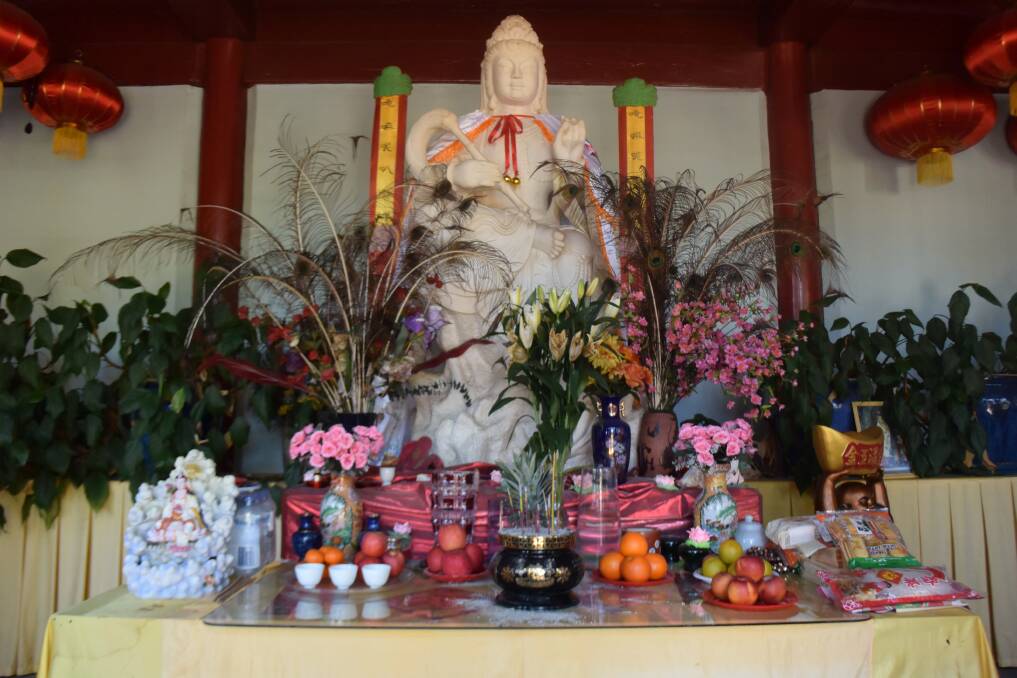 Inside the temple within the Chinese gardens - a living temple where Chinese people still leave offerings.