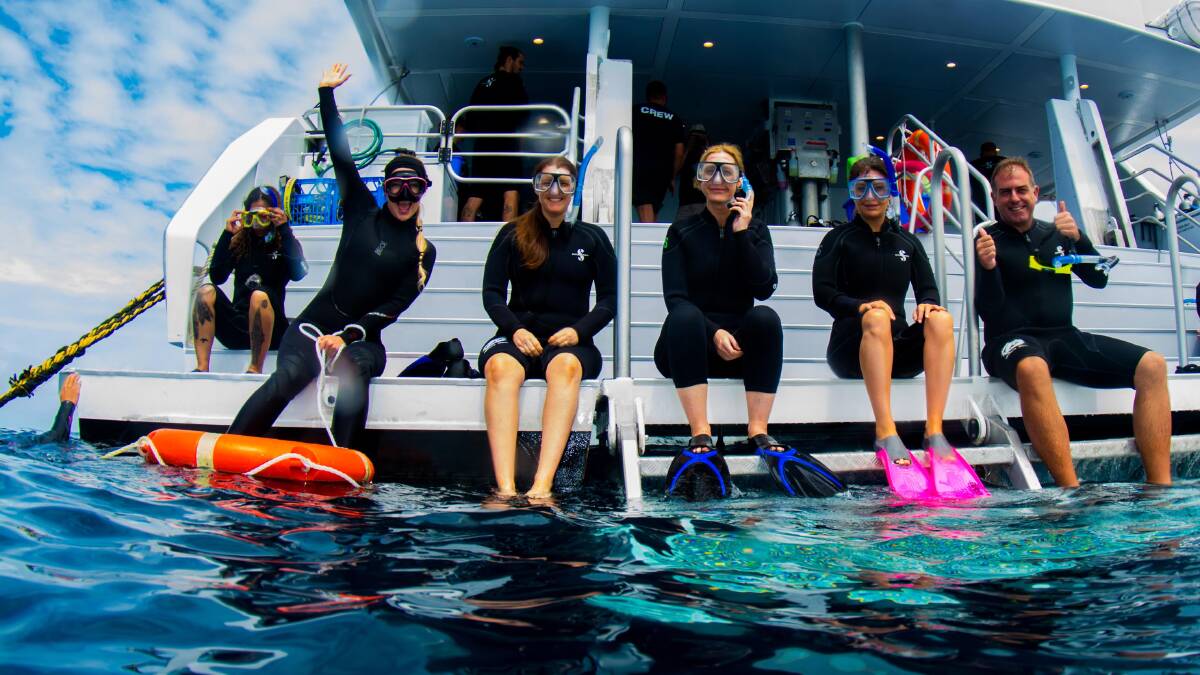 Ready to jump in … snorkellers on board AquaQuest.