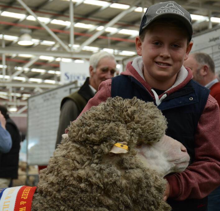 Harry Miller, Brimpaen, with the family's Glenpaen champion Merino ewe at the 2015 Australian Sheep & Wool Show.